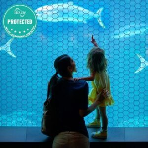 Antimicrobial film protecting woman and child at an aquarium.