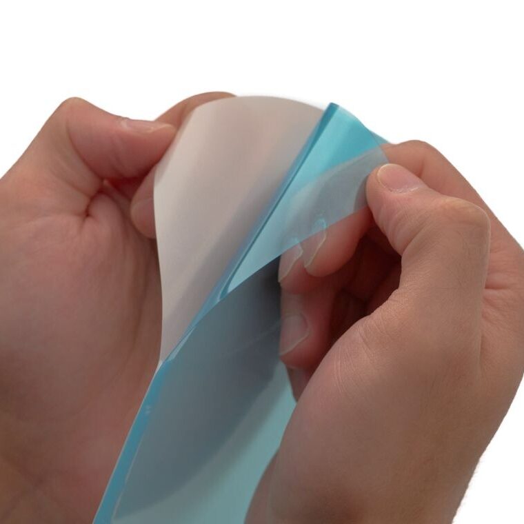 packaging films pulled off of blue release liner