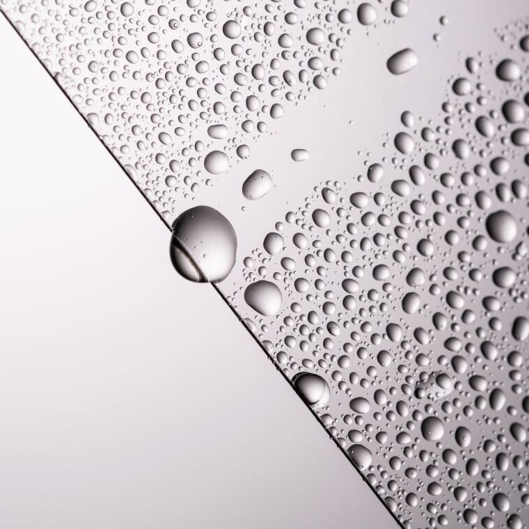 Hydrophobic films with water droplets on a white background.