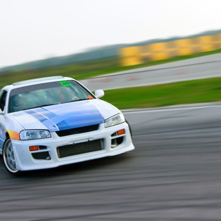 Car on a race track sliding.