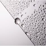 Hydrophobic clear material with water droplets on a white background.